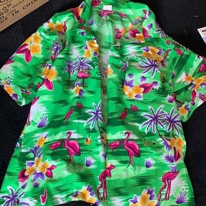 Has flowers flamingos green pink purple orange and white